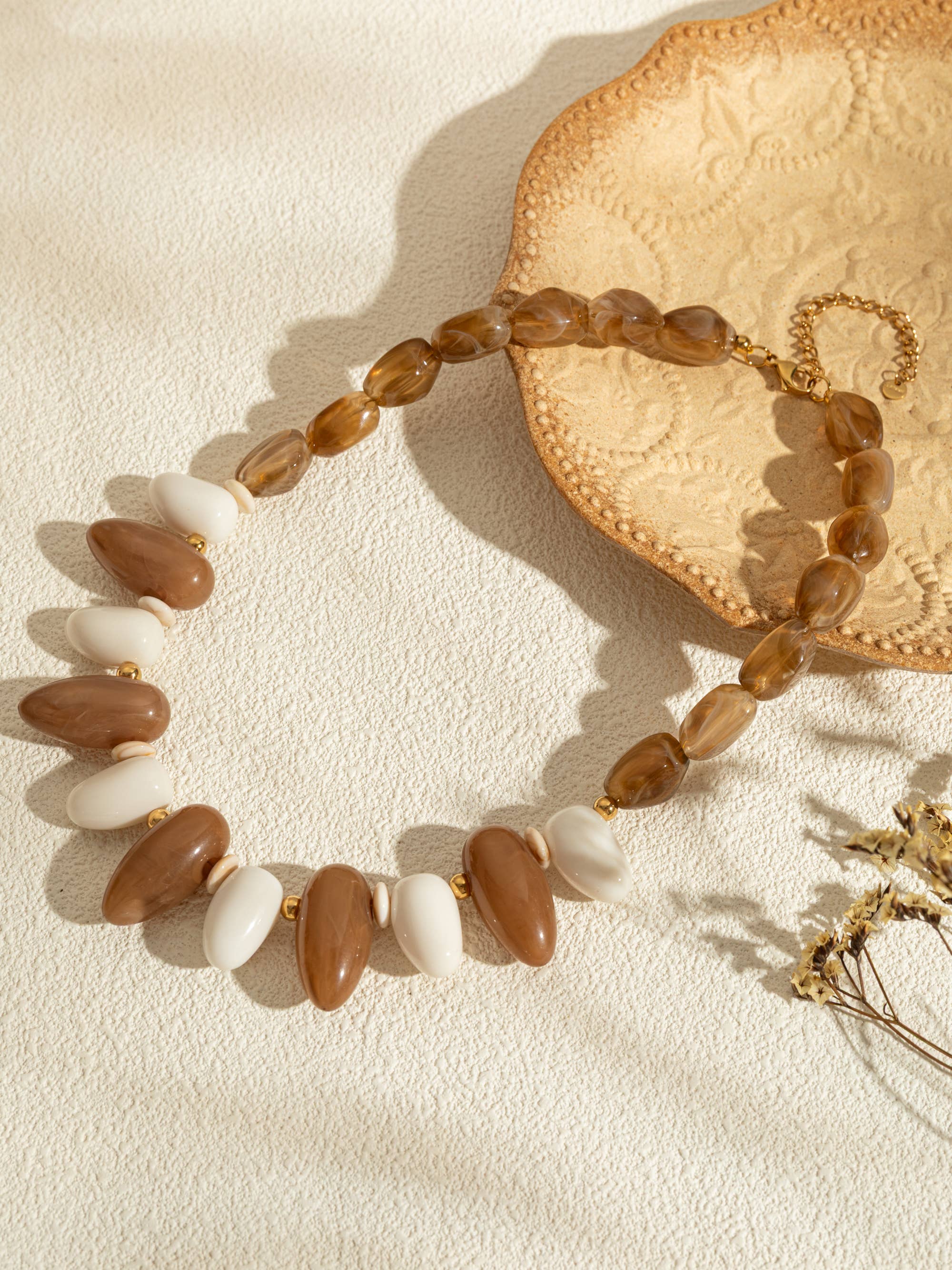 Ovale harskettingen in kleur met een chique gouden ketting