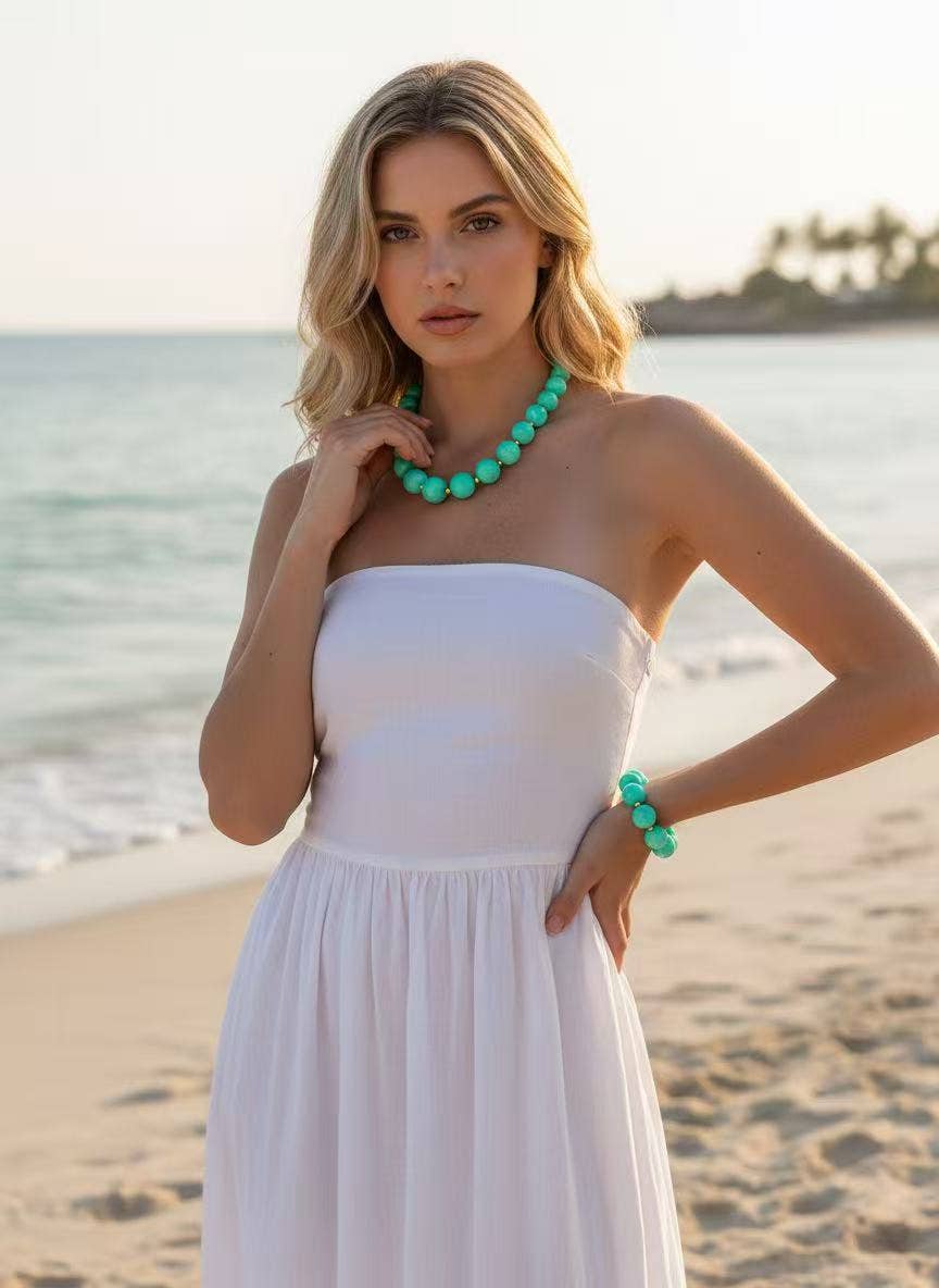 Damesketting met gouden, ronde, gemarmerde gekleurde harskralen