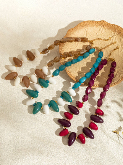 Ovale harskettingen in kleur met een chique gouden ketting