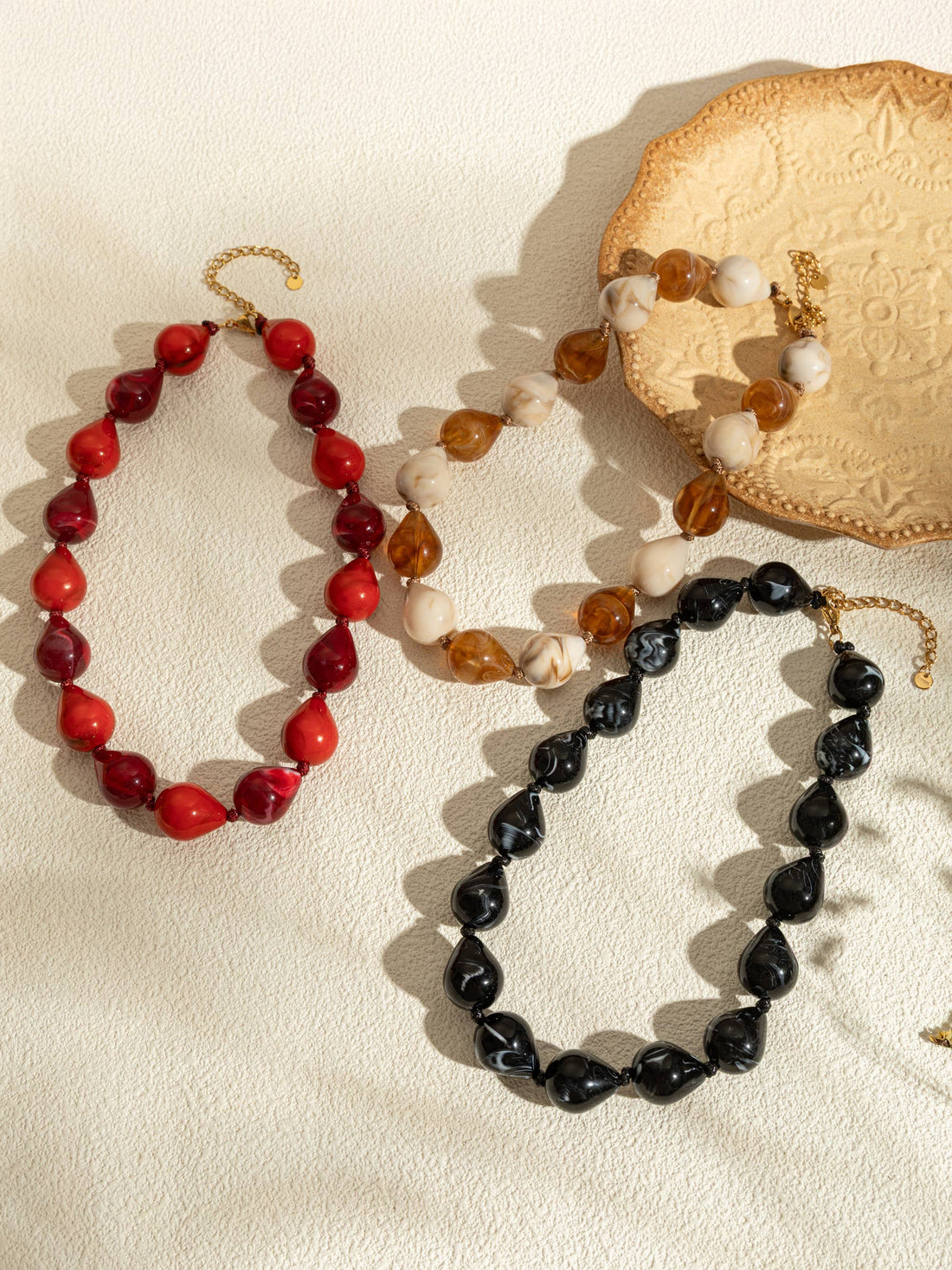 Harsdruppelkettingen in kleur met chique vergulde stalen ketting