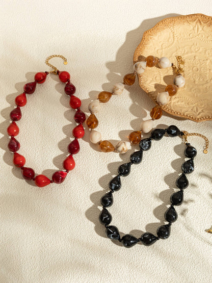 Harsdruppelkettingen in kleur met chique vergulde stalen ketting