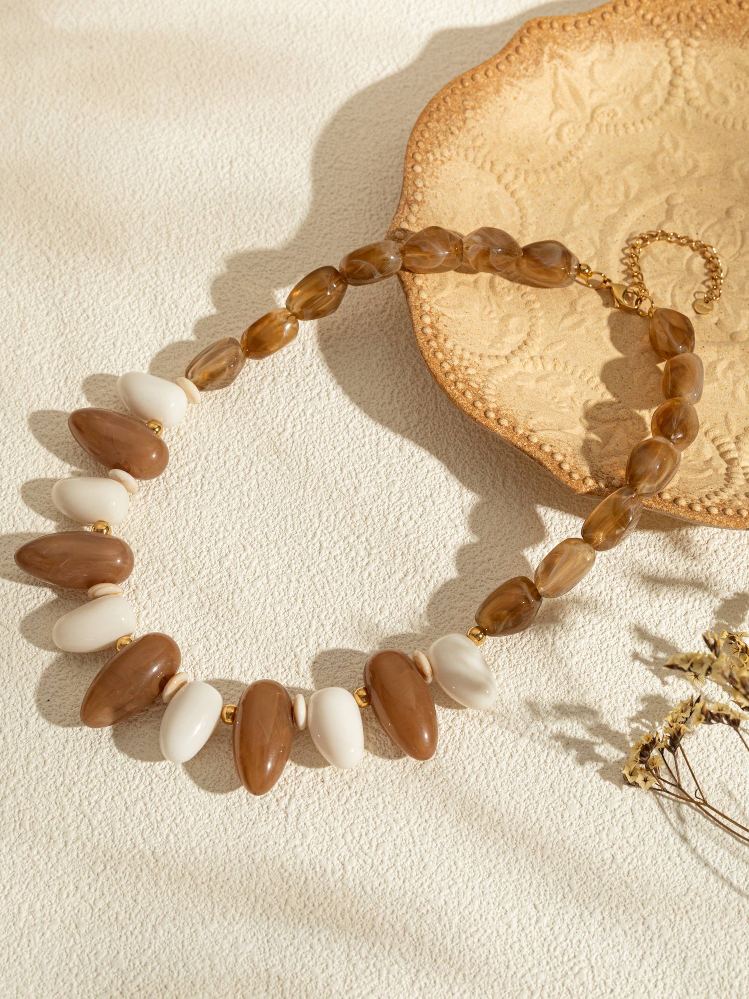 Ovale harskettingen in kleur met een chique gouden ketting