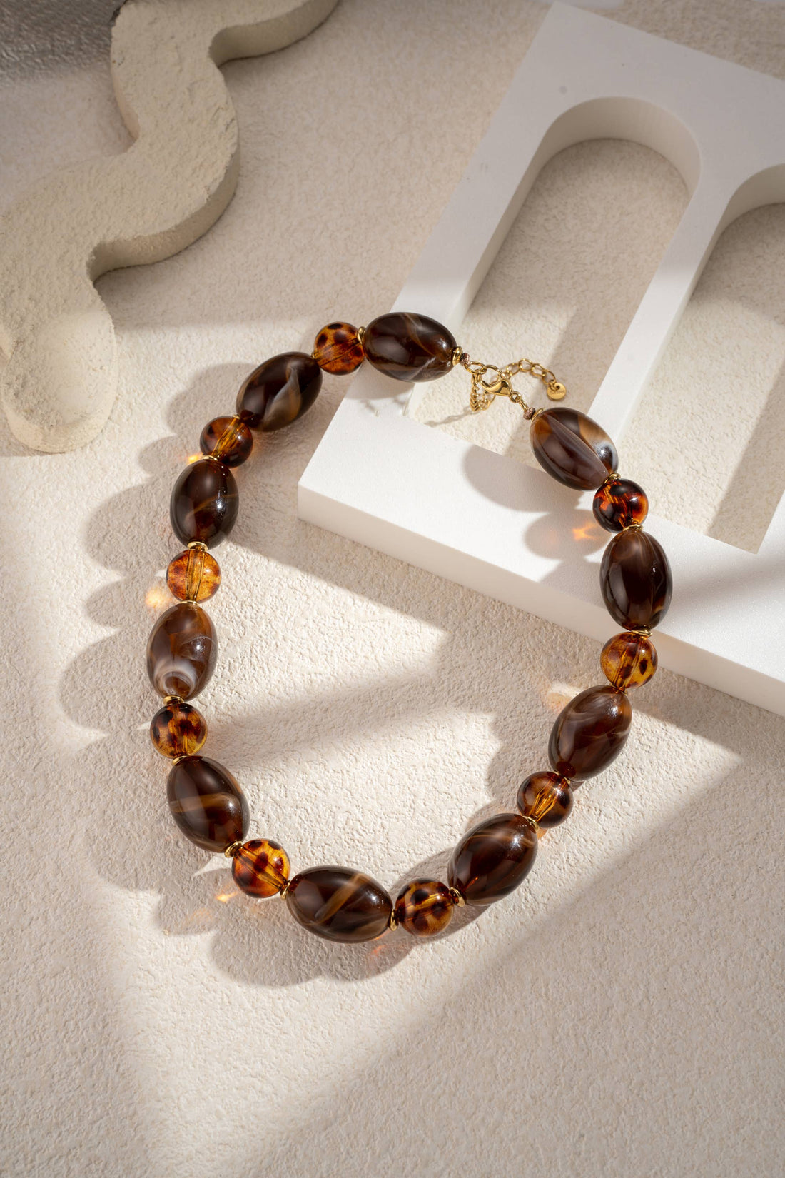 Luipaard en chocolade hars parelketting roestvrij staal chic