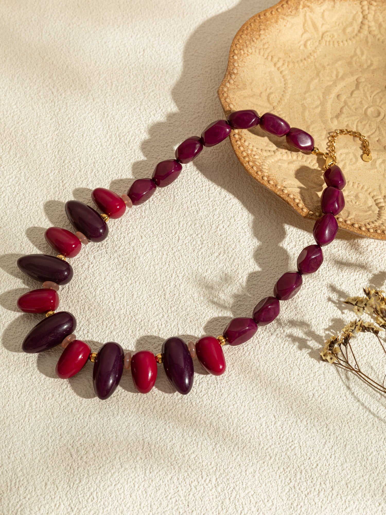 Ovale harskettingen in kleur met een chique gouden ketting